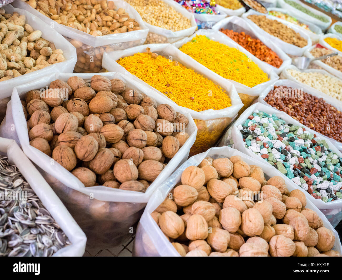Several bags with colorful food and spices in a market souq at Nizwa, Oman Stock Photo
