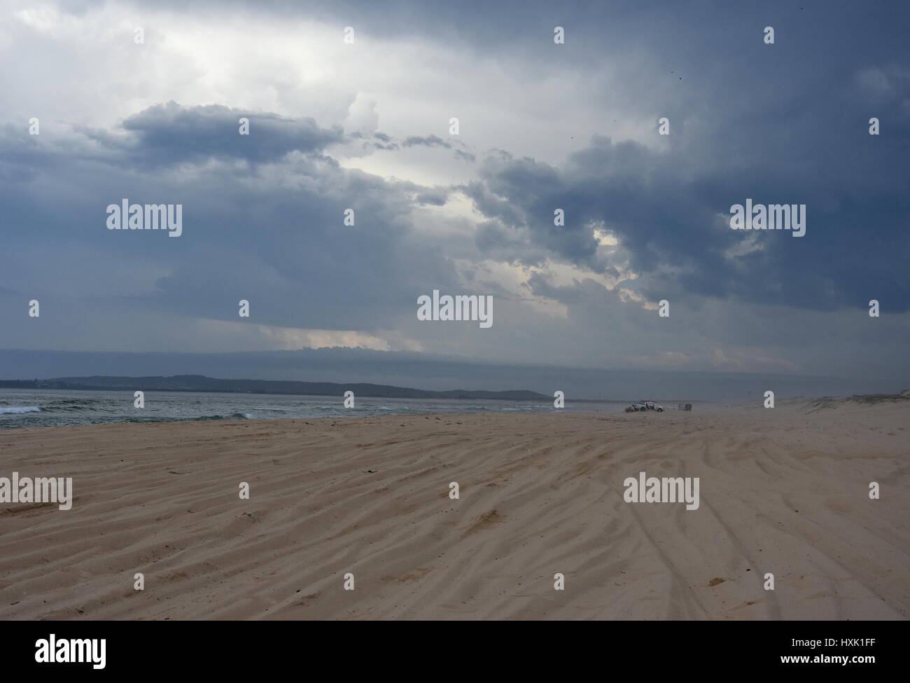 Horizontal landscape of the beach with cars (Belmont - Nine Miles - Beach, NSW, Australia). Stock Photo