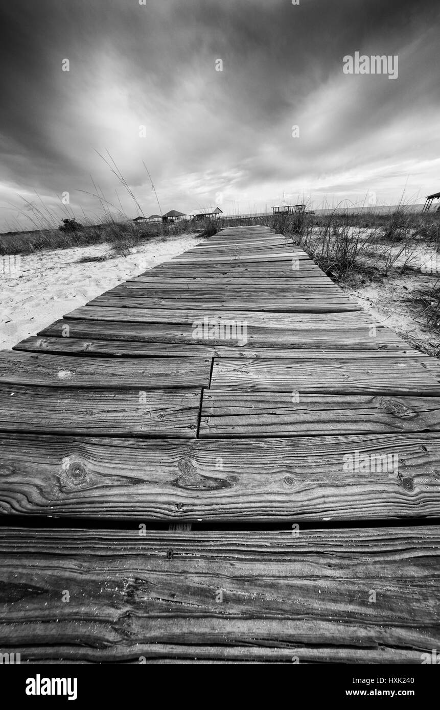 Point Clear AL USA - May 2, 2014  -  Wooden walkway across the sand in Black and White Stock Photo
