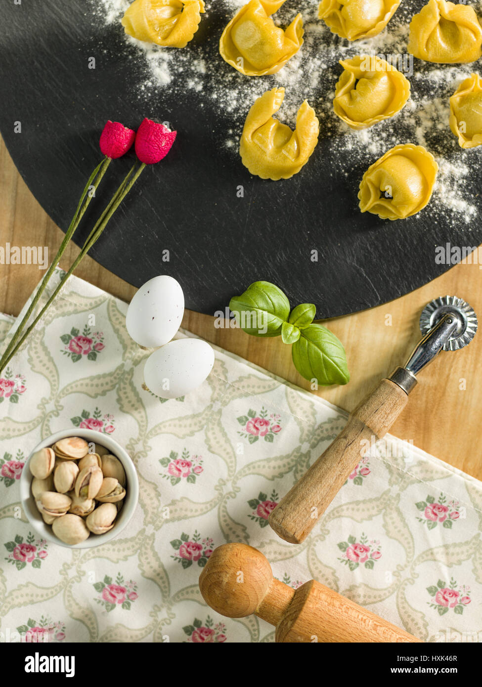 homemade Tortellini stuffed over a black stone ardesian Stock Photo