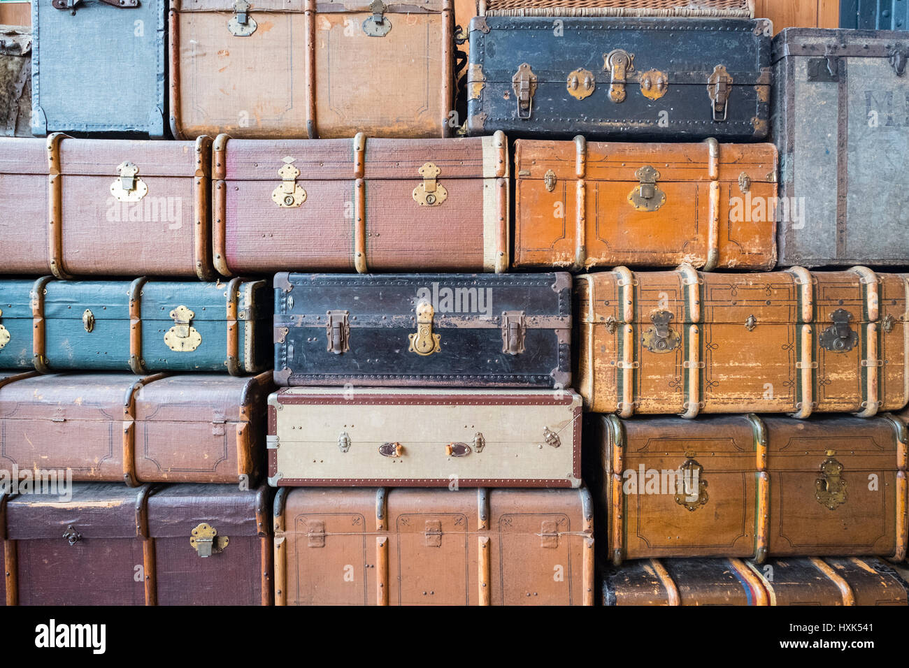 Many old suitcases stacked up Stock Photo