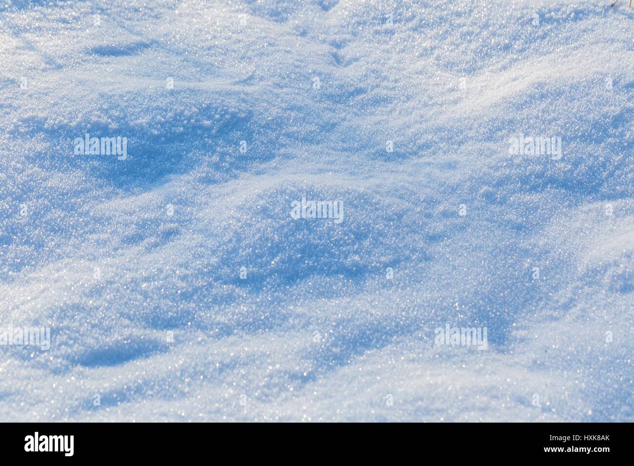 Snow background in close up. Surface of fresh winter snow in sunset ...