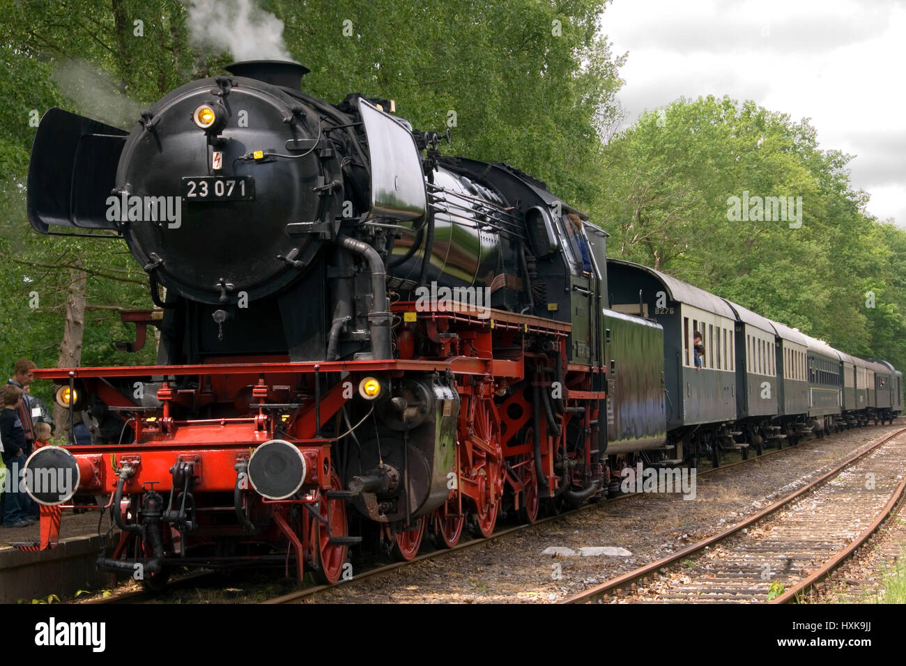 Historic steam train standing still at a train station in the ...