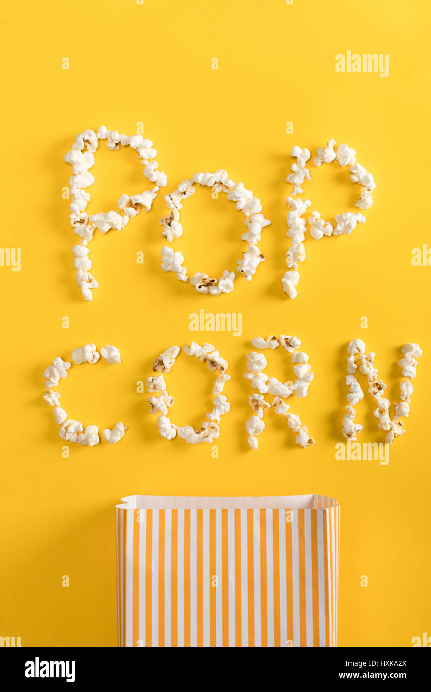Top view of Pop corn lettering  made from popcorn on yellow Stock Photo