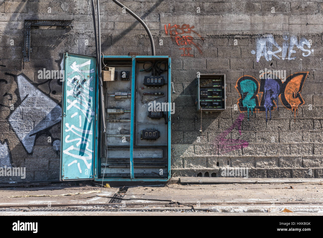 Old electrical cabinet open and empty in abandoned hangar Stock Photo