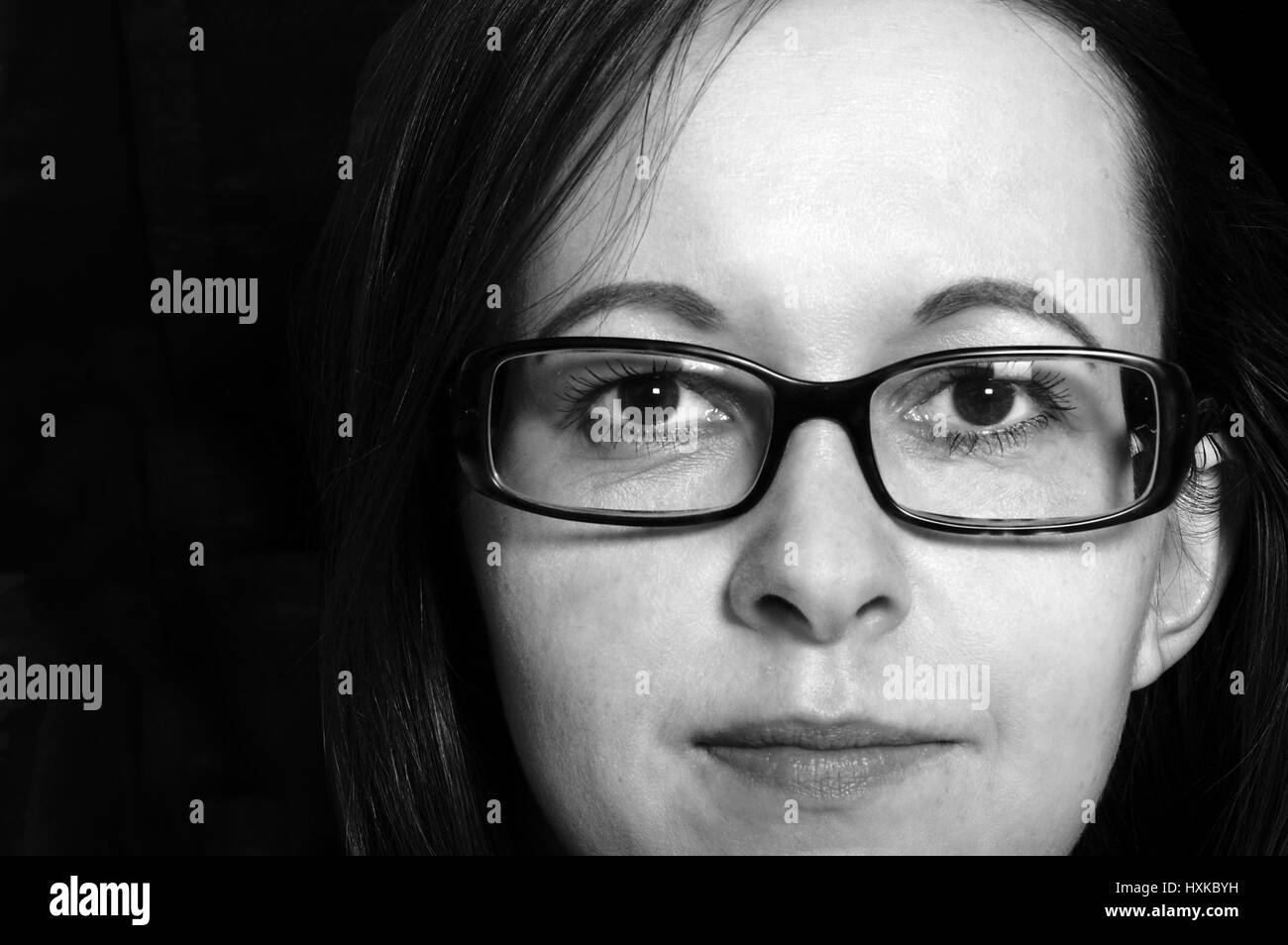 Wearing glasses woman in Black and White Stock Photos & Images - Alamy
