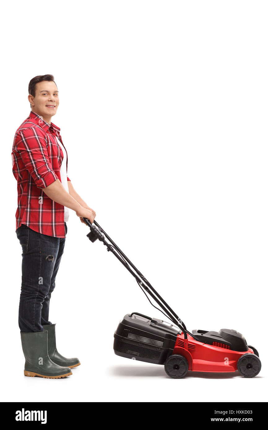 Full length portrait of a gardener with a lawnmower isolated on white background Stock Photo