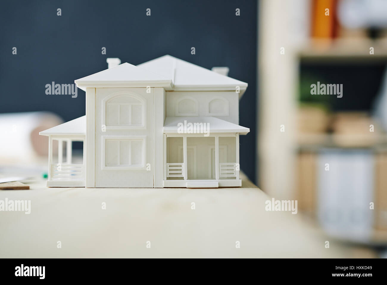 Paper House Model on Desk in Office Stock Photo