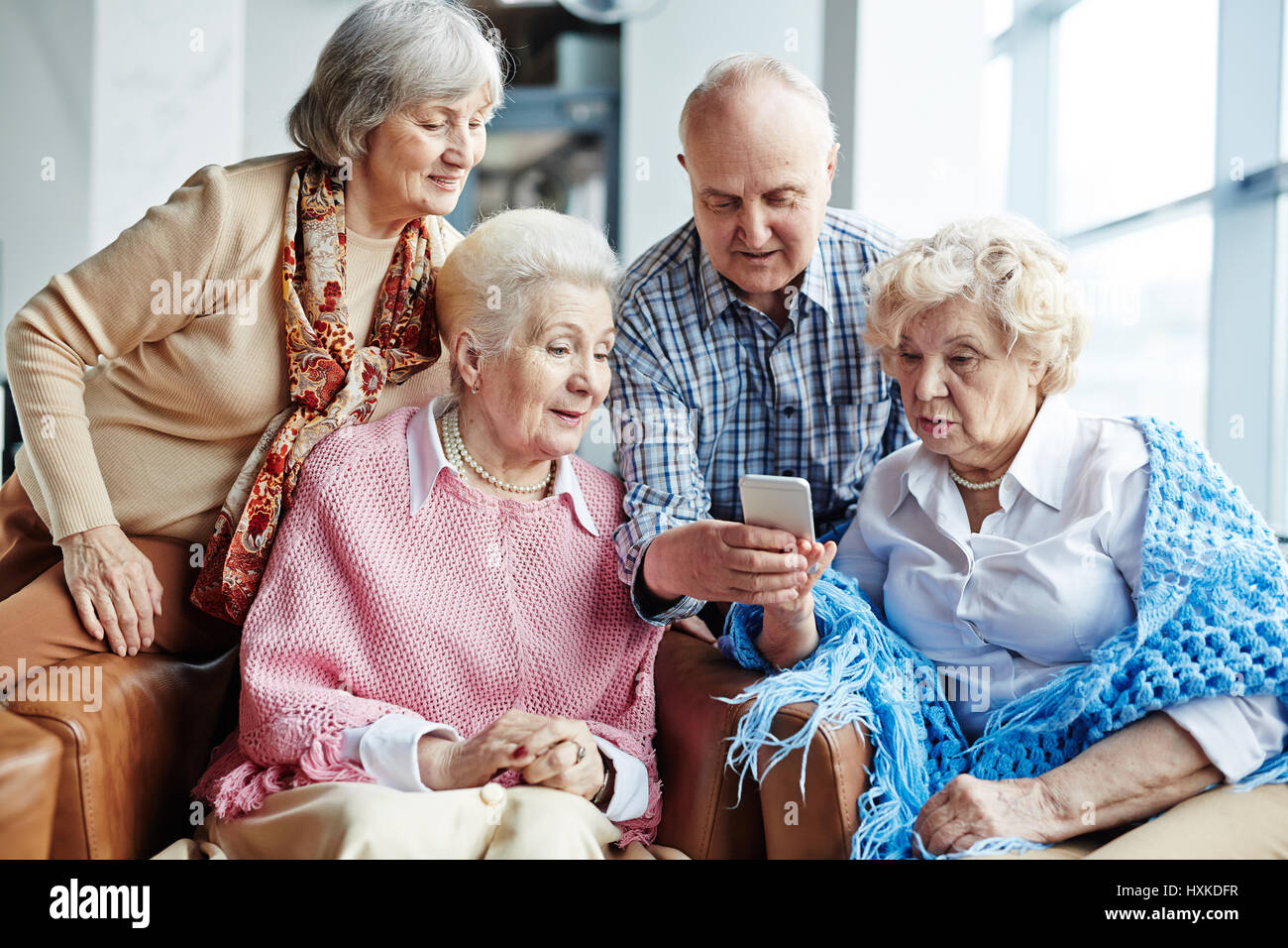 Group of senior people with smartphone Stock Photo