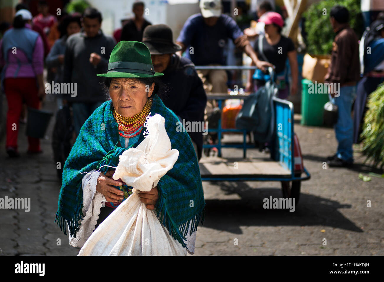 Otavalo, Ecuador - February 1, 2014: Indigenous woman in a market  the town of Otavalo in Ecuador. Stock Photo