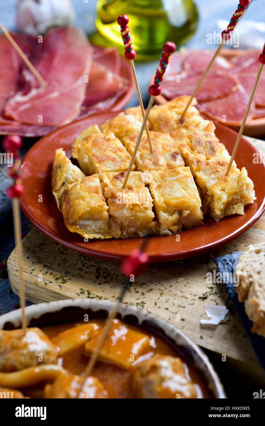closeup of some plates with different spanish tapas, such as a spanish