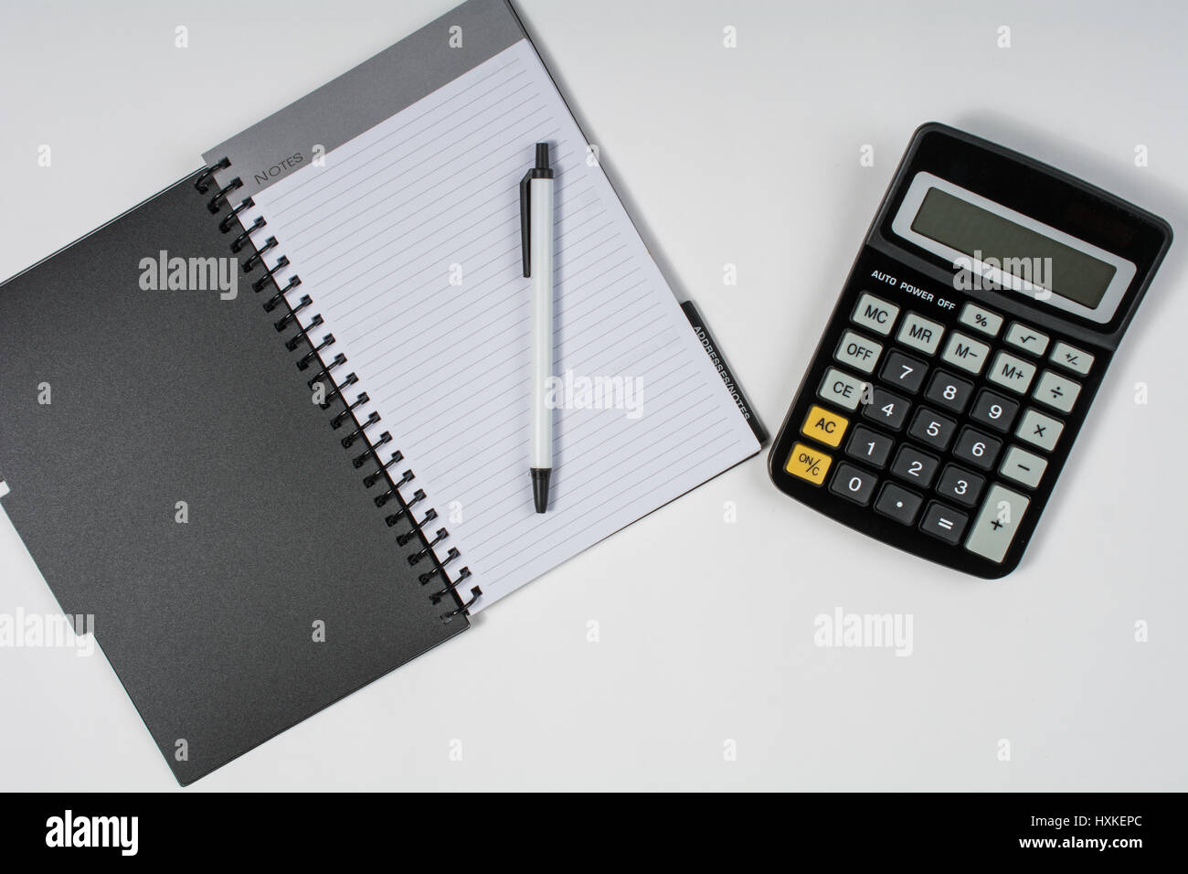 Notebook with pen and calculator Stock Photo Alamy