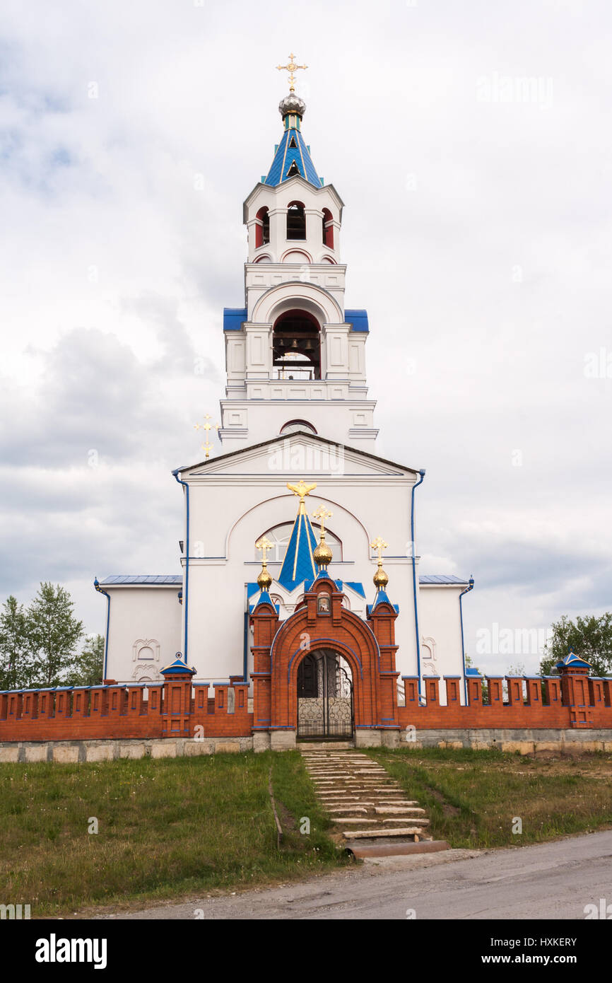 Pathway in form of stone steps to Church of the Dormition in summer day. Novoutkinsk, Russia. Stock Photo