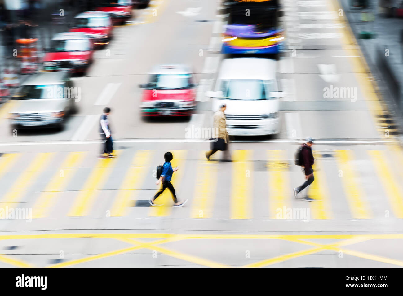 picture made with motion blur of people crossing a street in Hongkong ...