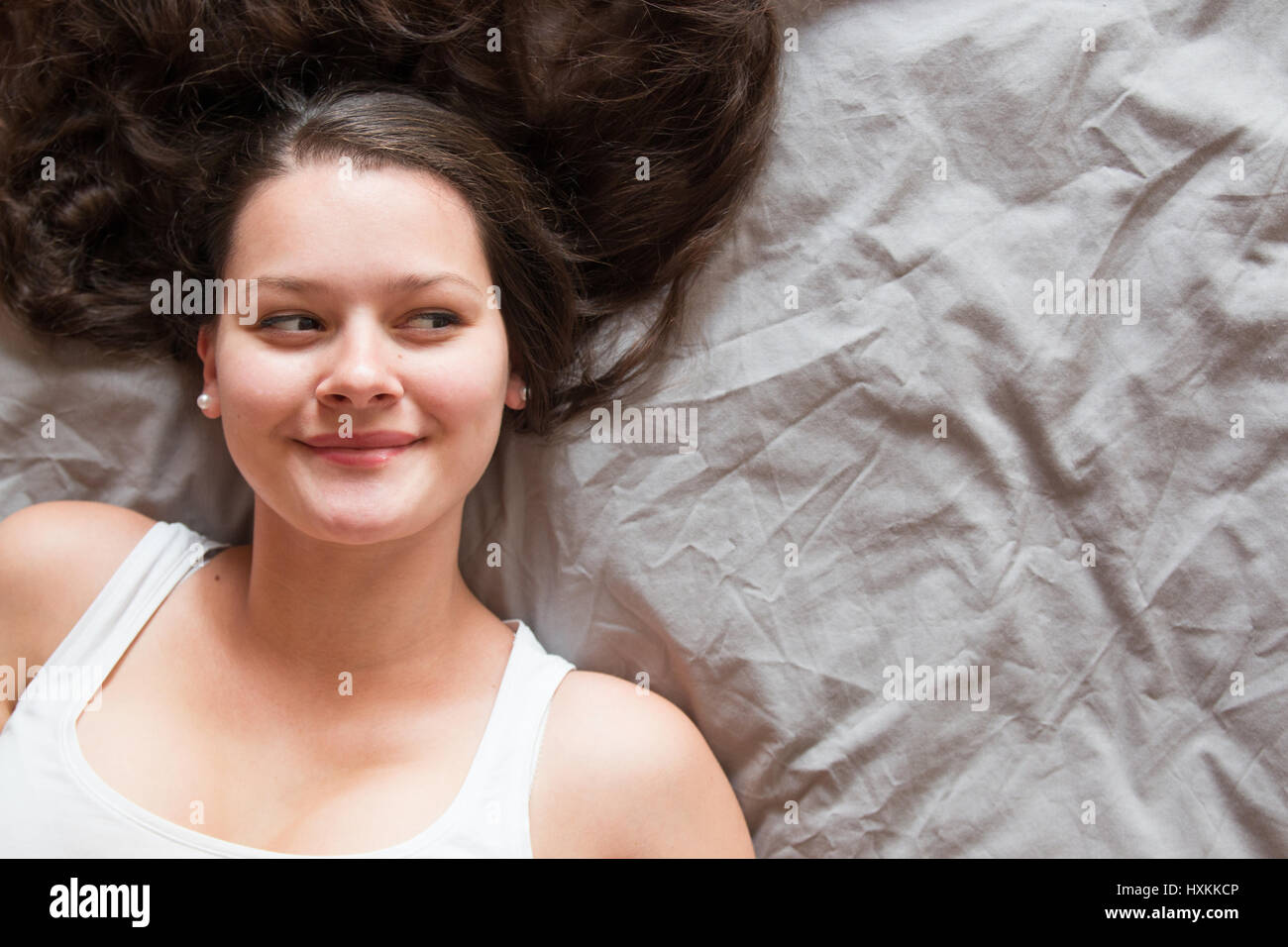 Charming woman Smile face close up and she lying on the bed, girl with