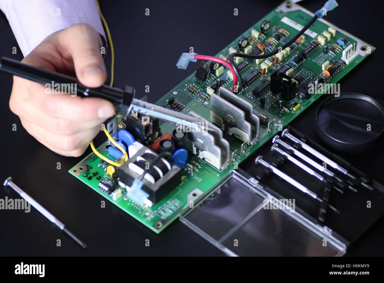 man hands chip soldering tools Stock Photo Alamy