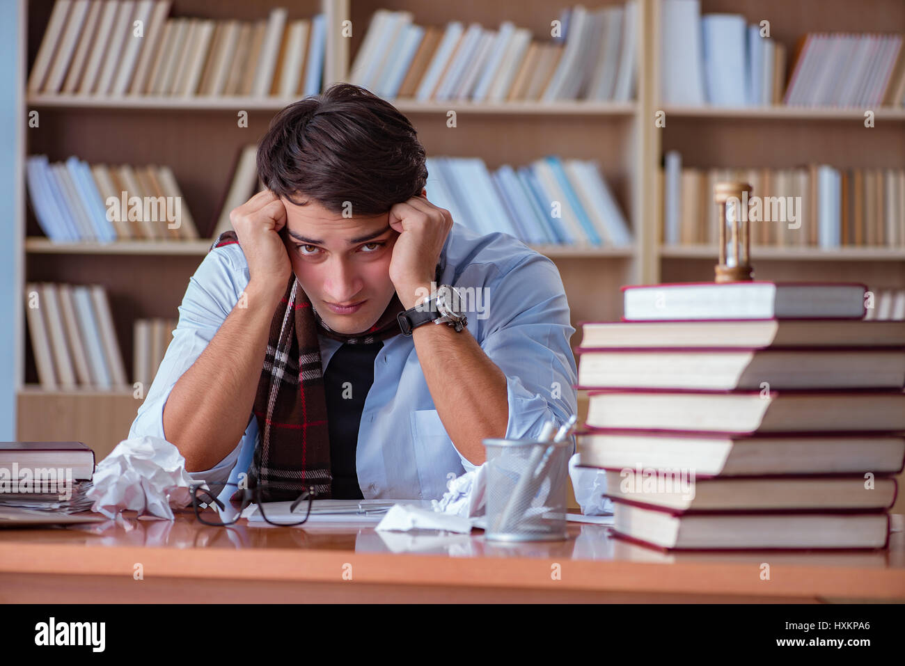 Writer In Library Young book writer writing in library Stock Photo - Alamy