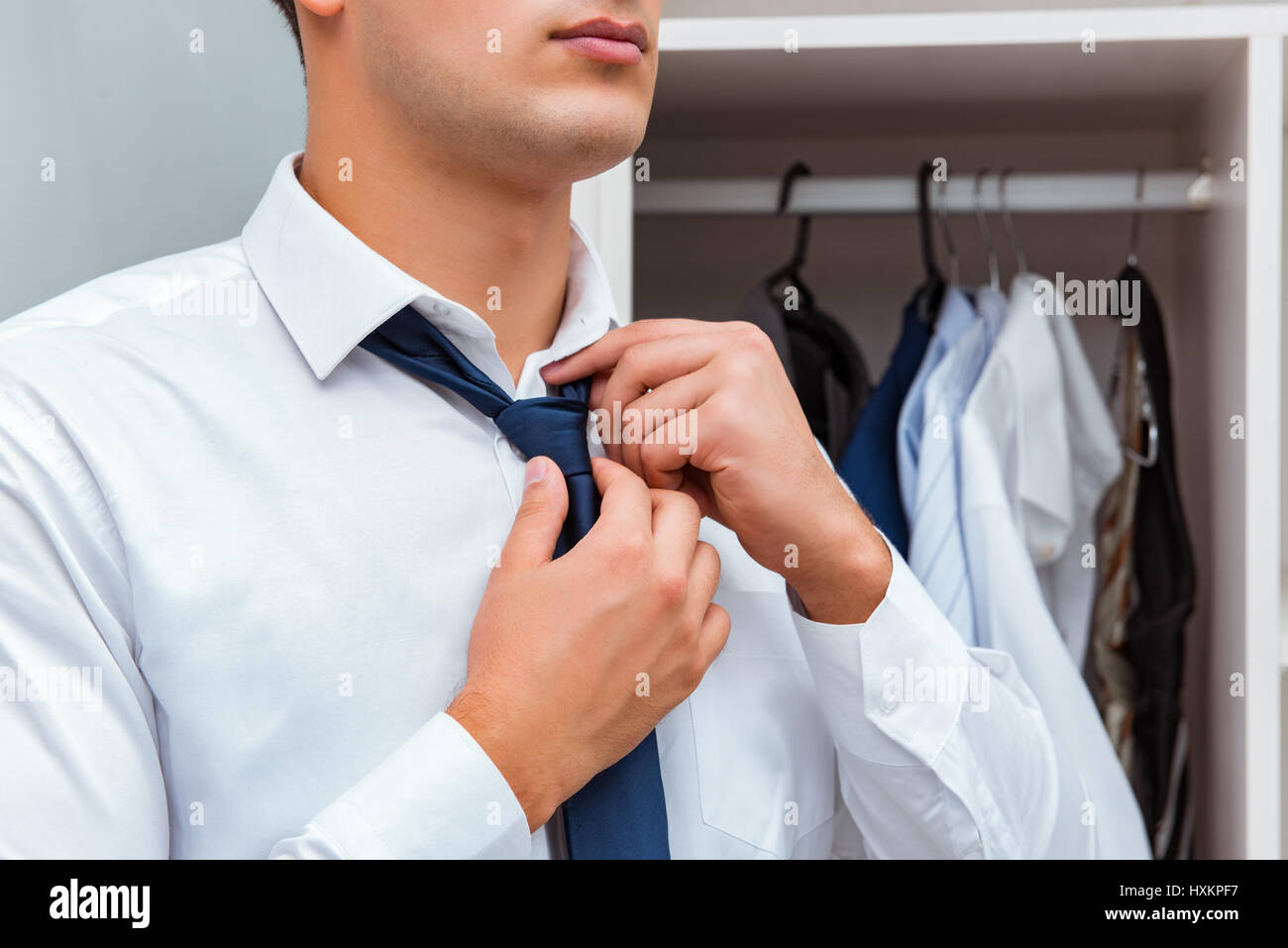 Businessman dressing up for work Stock Photo - Alamy