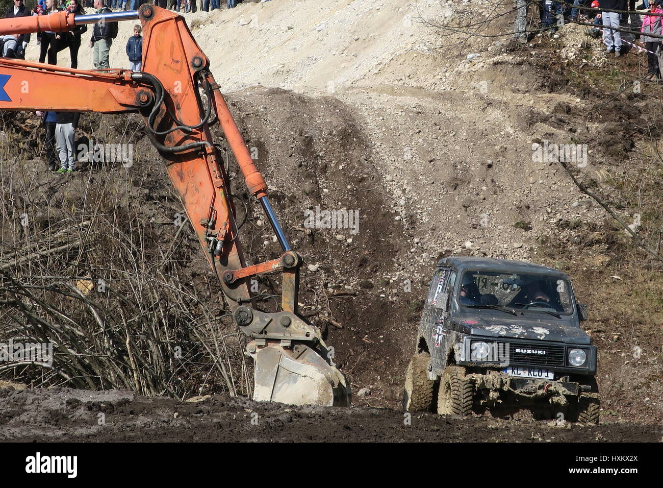 An excavator for pulling the offroad cars out of the muddy trench. An