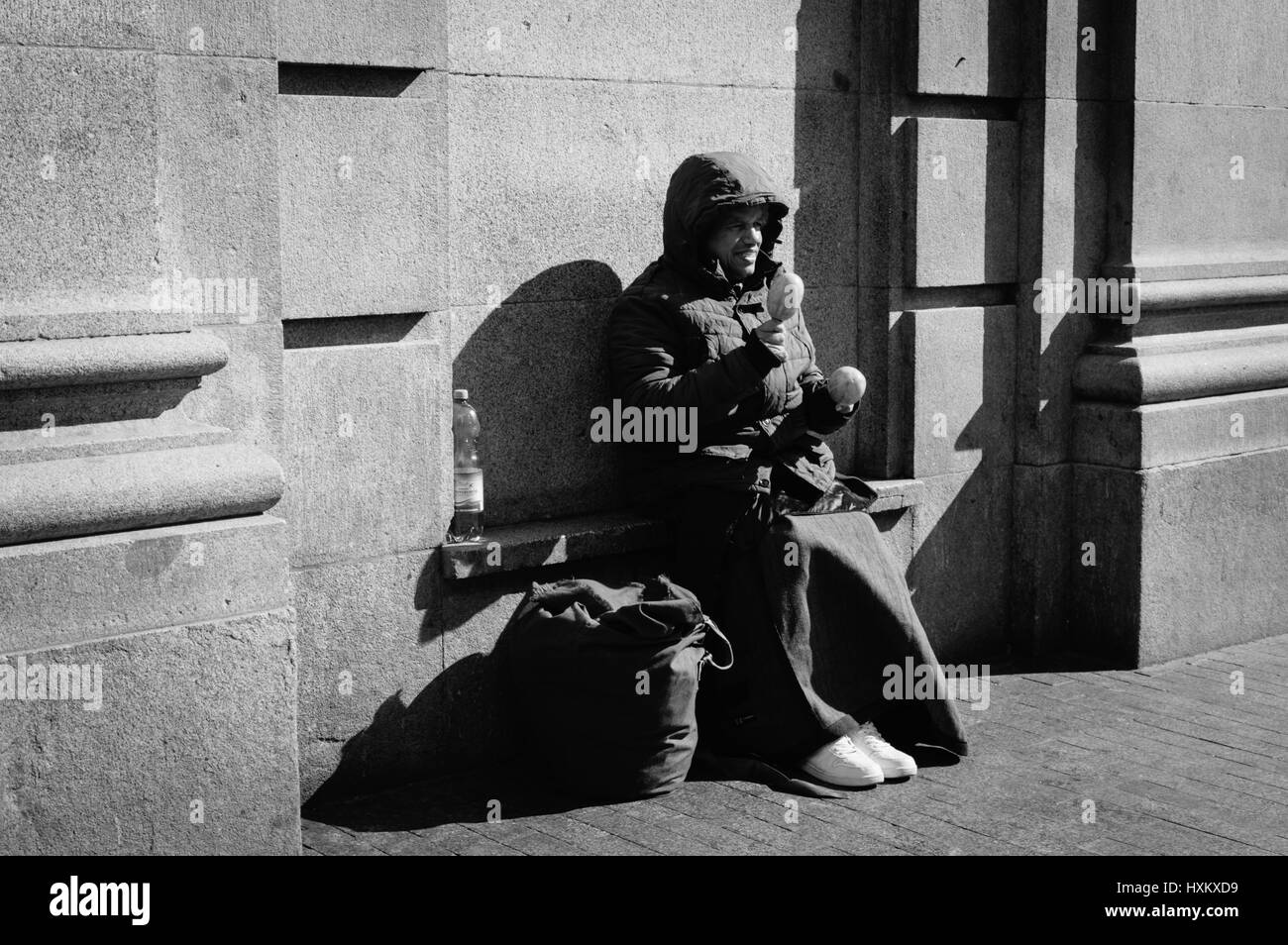 Madrid, Spain - September 18, 2016:  Unindentified man beggar asked for money on a busy street in the center of Madrid Stock Photo