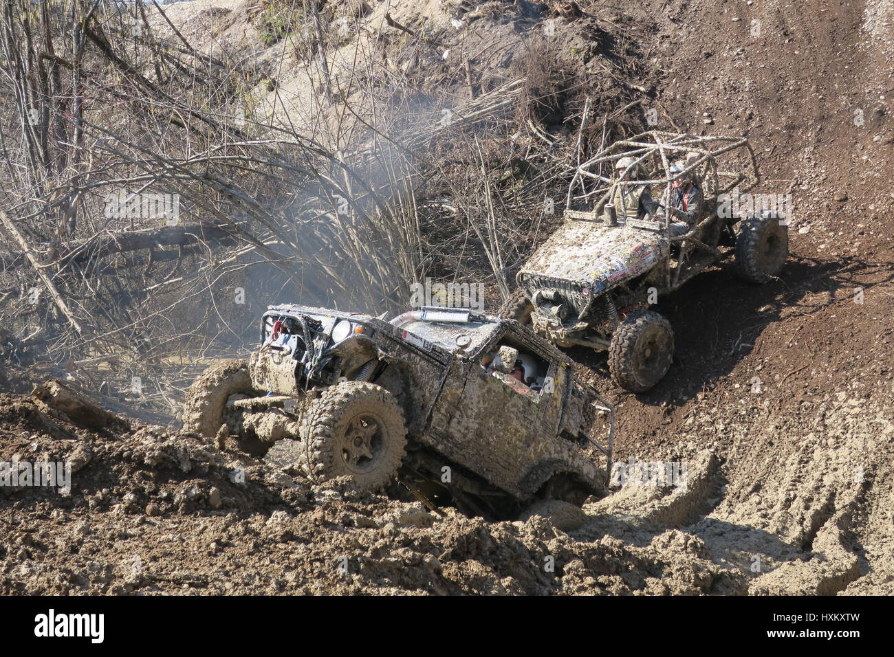 The offroad car gets stuck at a muddy hill and the other fourwheel
