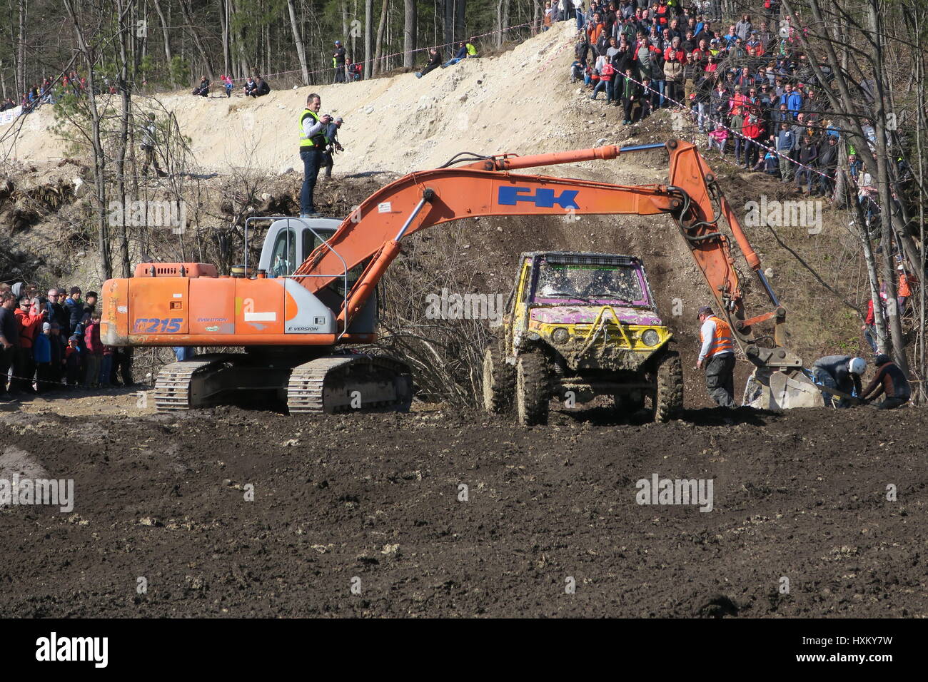 An excavator for pulling the offroad cars out of the muddy trench. An