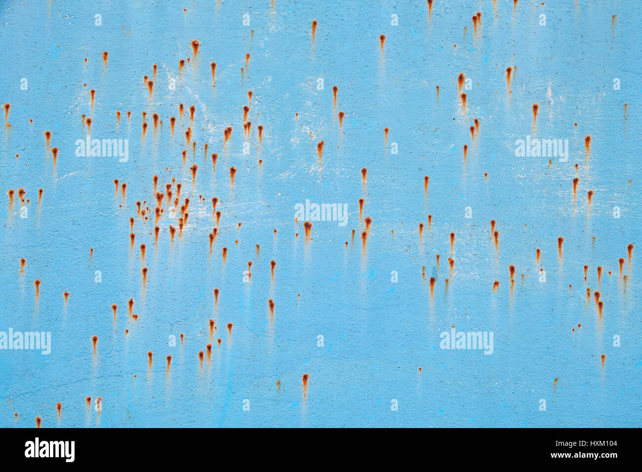 Old blue metal wall with rust specks, grungy industrial background ...