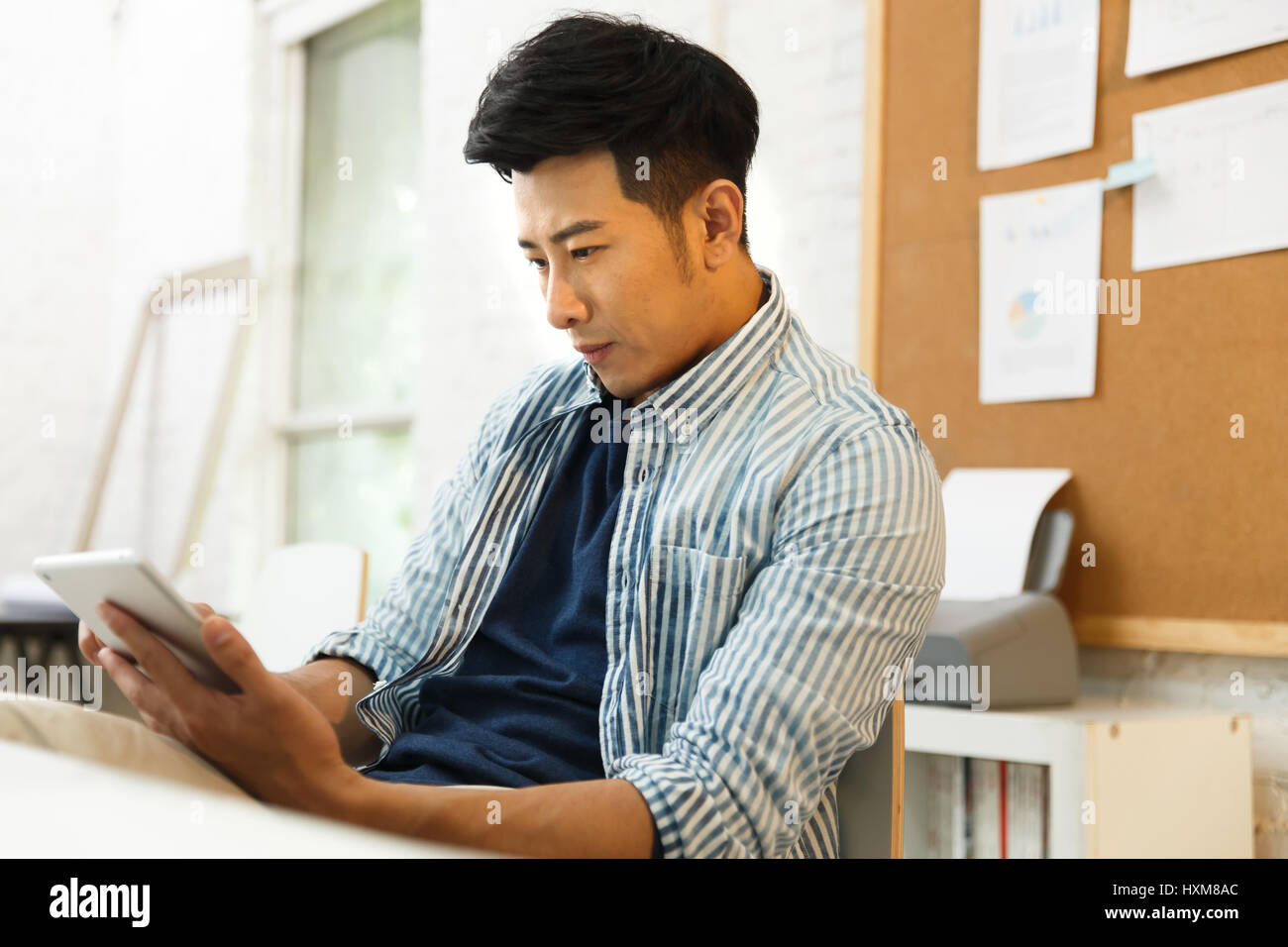 Young man using computer at home Stock Photo - Alamy
