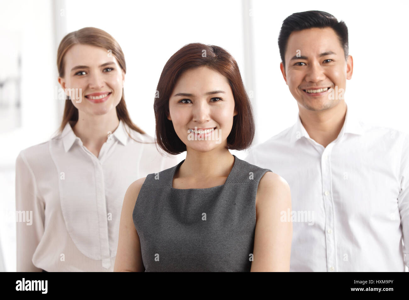 Portrait of three business people Stock Photo - Alamy