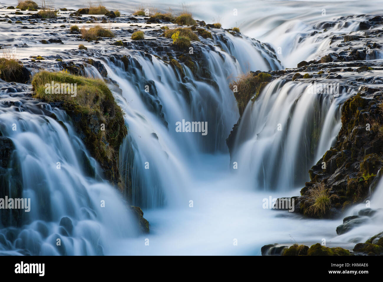 Detail shot of Bruarafoss or Bruarfoss waterfall as the blue glacial water flows over it, Iceland Stock Photo