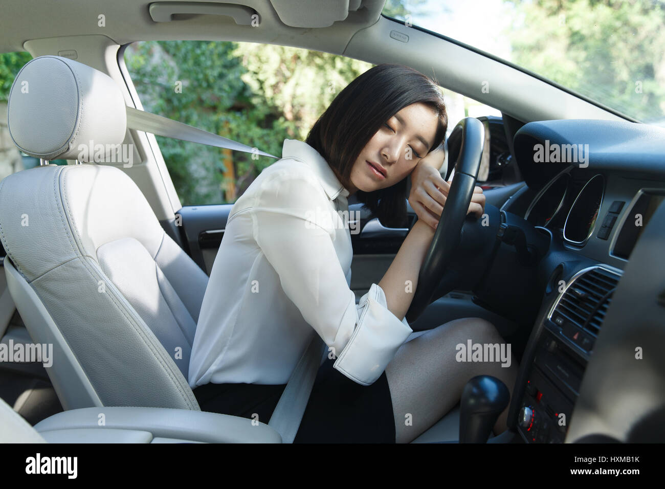 Young woman sleeping in car Stock Photo Alamy