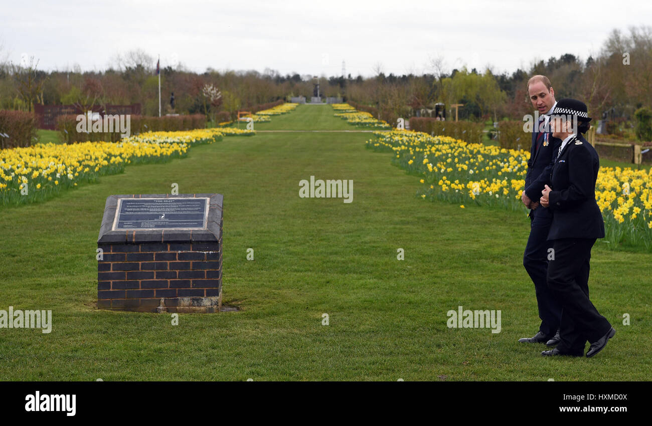 The Duke of Cambridge walks with Staffordshire Police Chief Constable Jane Sawyers, after laying a wreath at the Police memorial, at the National Arboretum in Alrewas, Staffordshire. Stock Photo