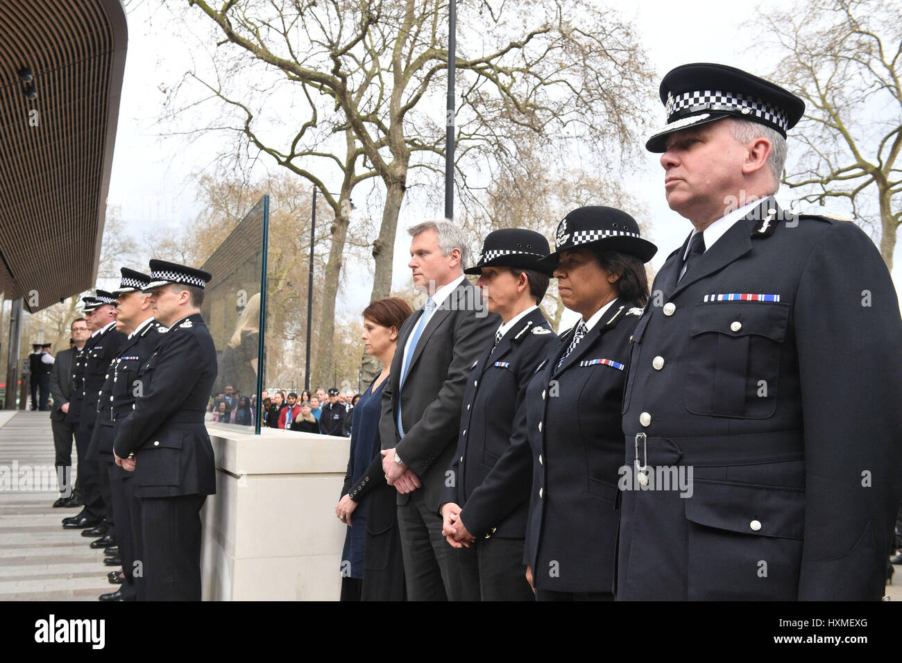 Acting Metropolitan Police Commissioner Craig Mackey leads a minutes silence outside New Scotland Yard in London, exactly a week since the Westminster terror attack took place. Stock Photo
