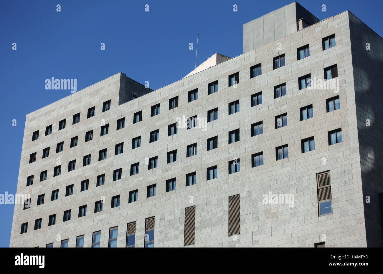 Office building facade, blue sky Stock Photo - Alamy