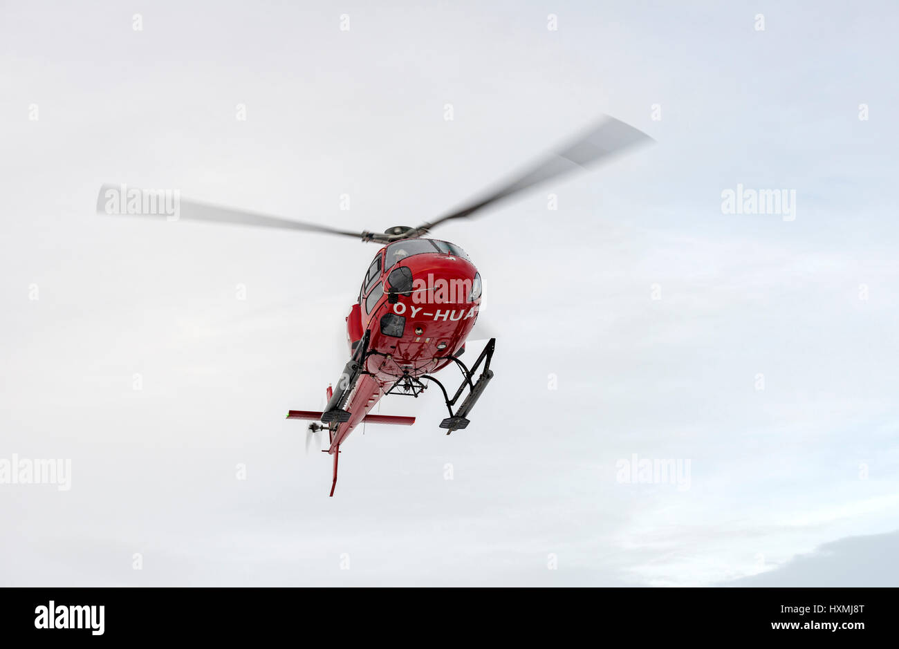 A tourist helicopter landing in the tiny inuit settlement of Oqaatsut, formerly known as Rodebay Stock Photo
