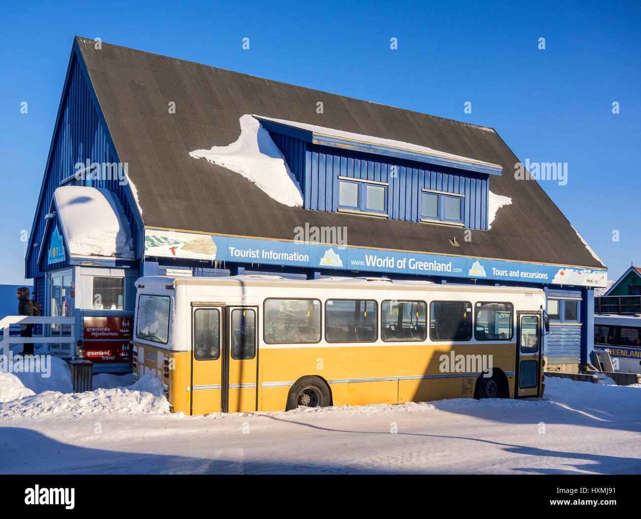 A bus in a snowdrift in Ilulissat town, in west Greenland Stock Photo
