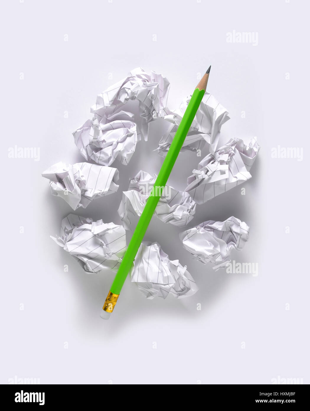gren pencil isolated on scrunched paper Stock Photo