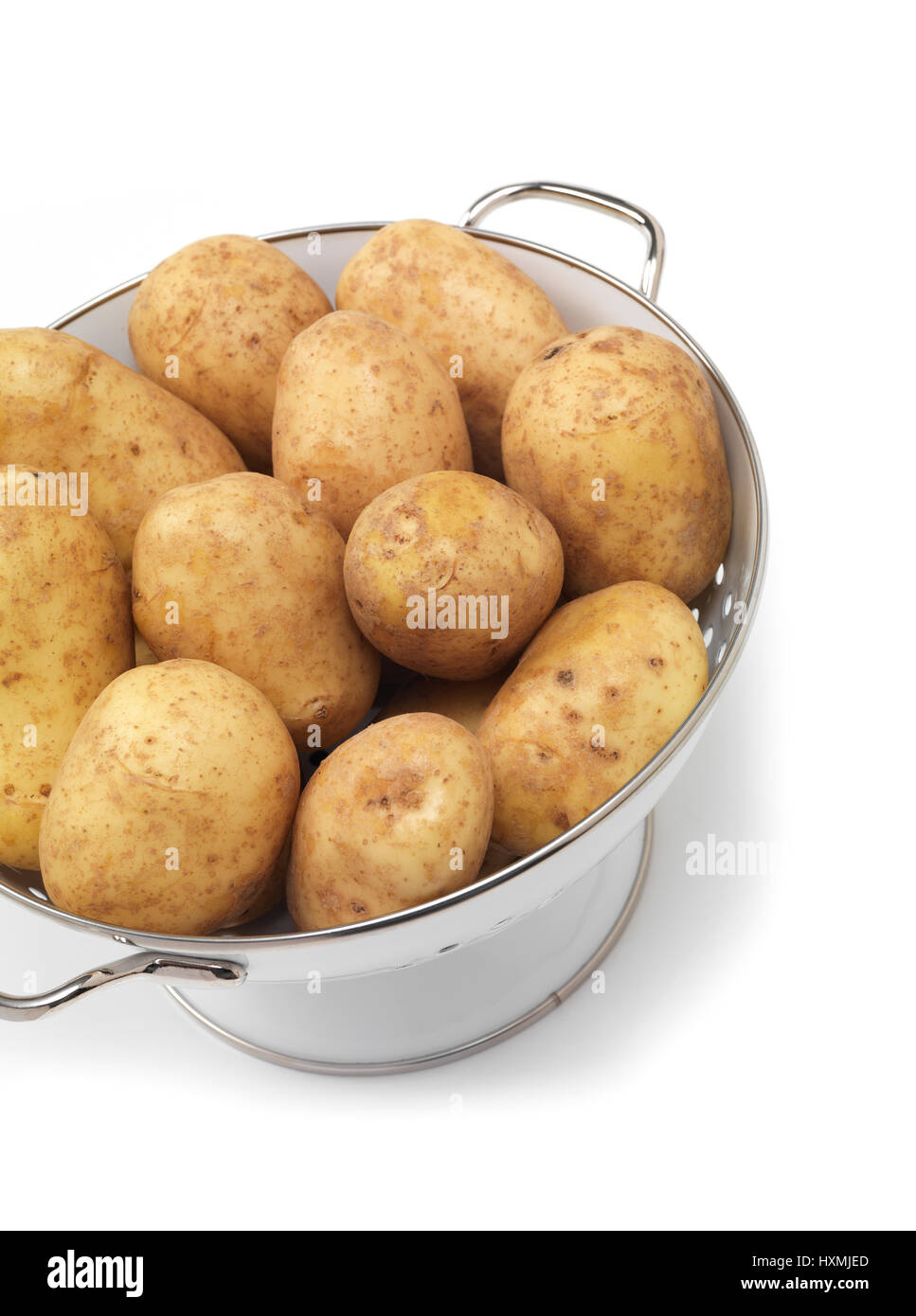 New potato in colander Stock Photo