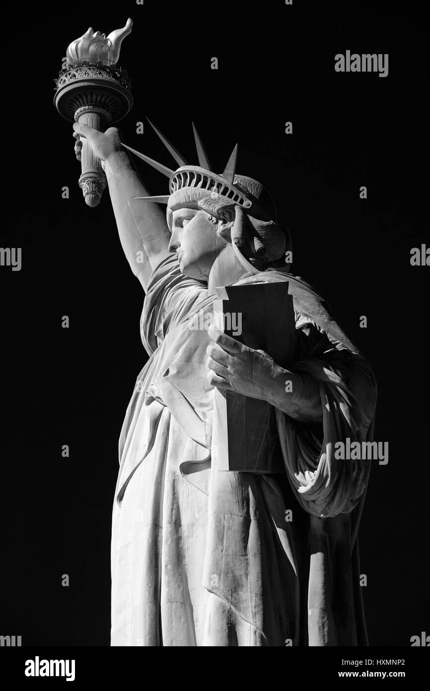 Statue of Liberty, black and white, side view with black sky in New York Stock Photo