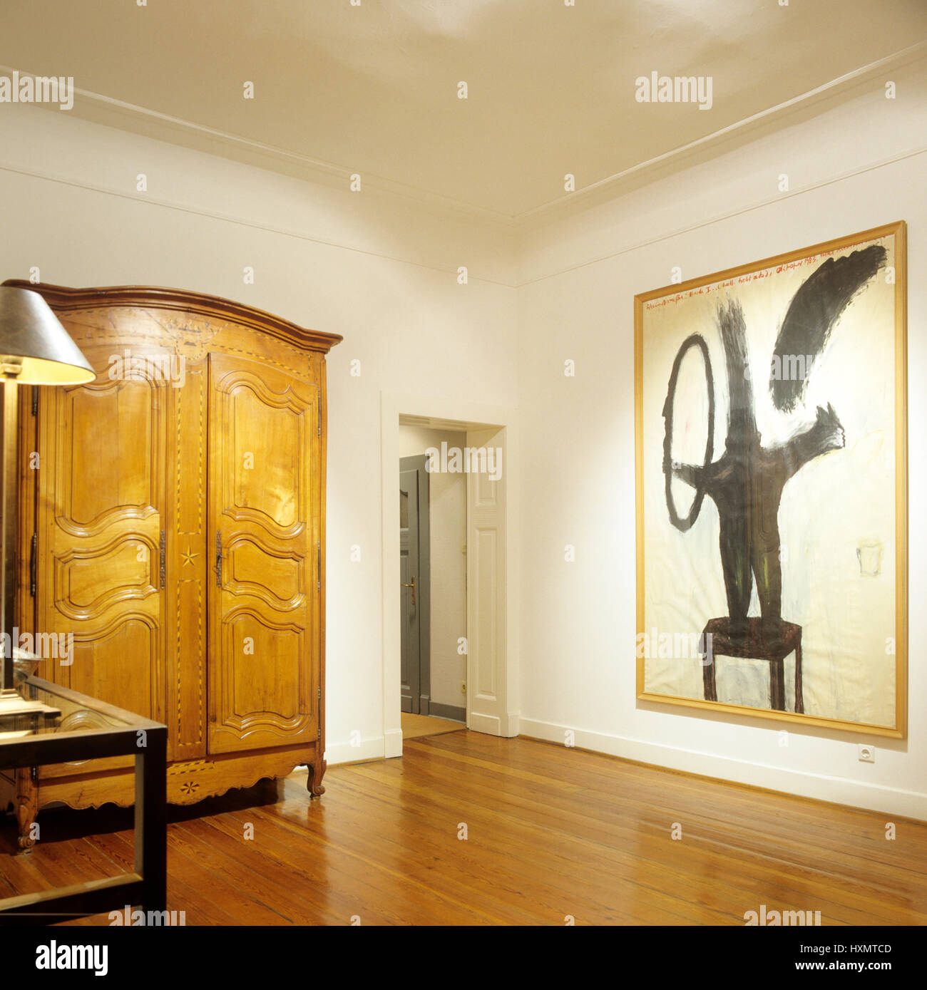 Wooden wardrobe with modern art Stock Photo Alamy