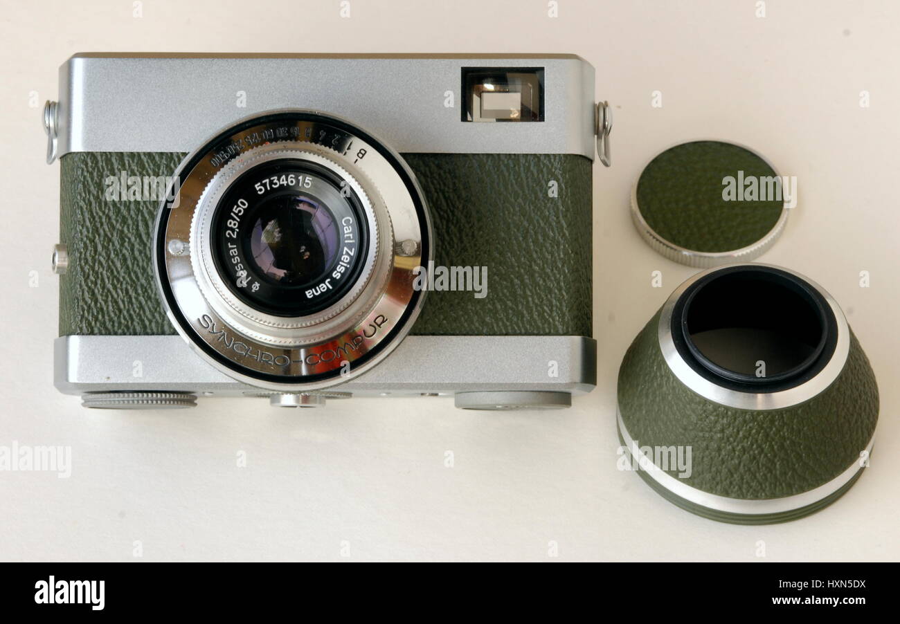 AJAXNETPHOTO. UNITED KINGDOM. - EAST GERMAN CAMERA - ORIGINAL WERRA 1 35MM FORMAT ANALOG FILM CAMERA WITH OLIVE GREEN LEATHERETTE COVERING MADE BY CARL ZEISS JENA SHOWN HERE WITH PROTECTIVE LENS BARREL COVER AND LENS CAP. PHOTO:JONATHAN EASTLAND/AJAX REF:D122405 2398 Stock Photo