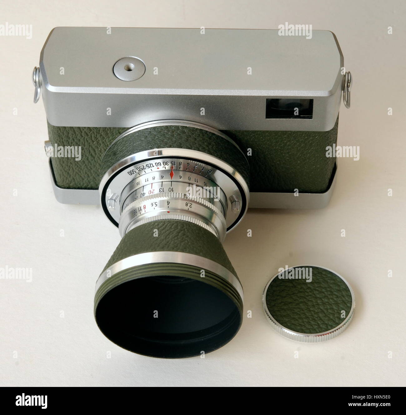 AJAXNETPHOTO. UNITED KINGDOM. - EAST GERMAN CAMERA - ORIGINAL WERRA 1 35MM FORMAT ANALOG FILM CAMERA WITH OLIVE GREEN LEATHERETTE COVERING MADE BY CARL ZEISS JENA SHOWN HERE WITH PROTECTIVE LENS BARREL COVER FITTED AS LENS HOOD AND LENS CAP. PHOTO:JONATHAN EASTLAND/AJAX REF:D122405 2401 Stock Photo