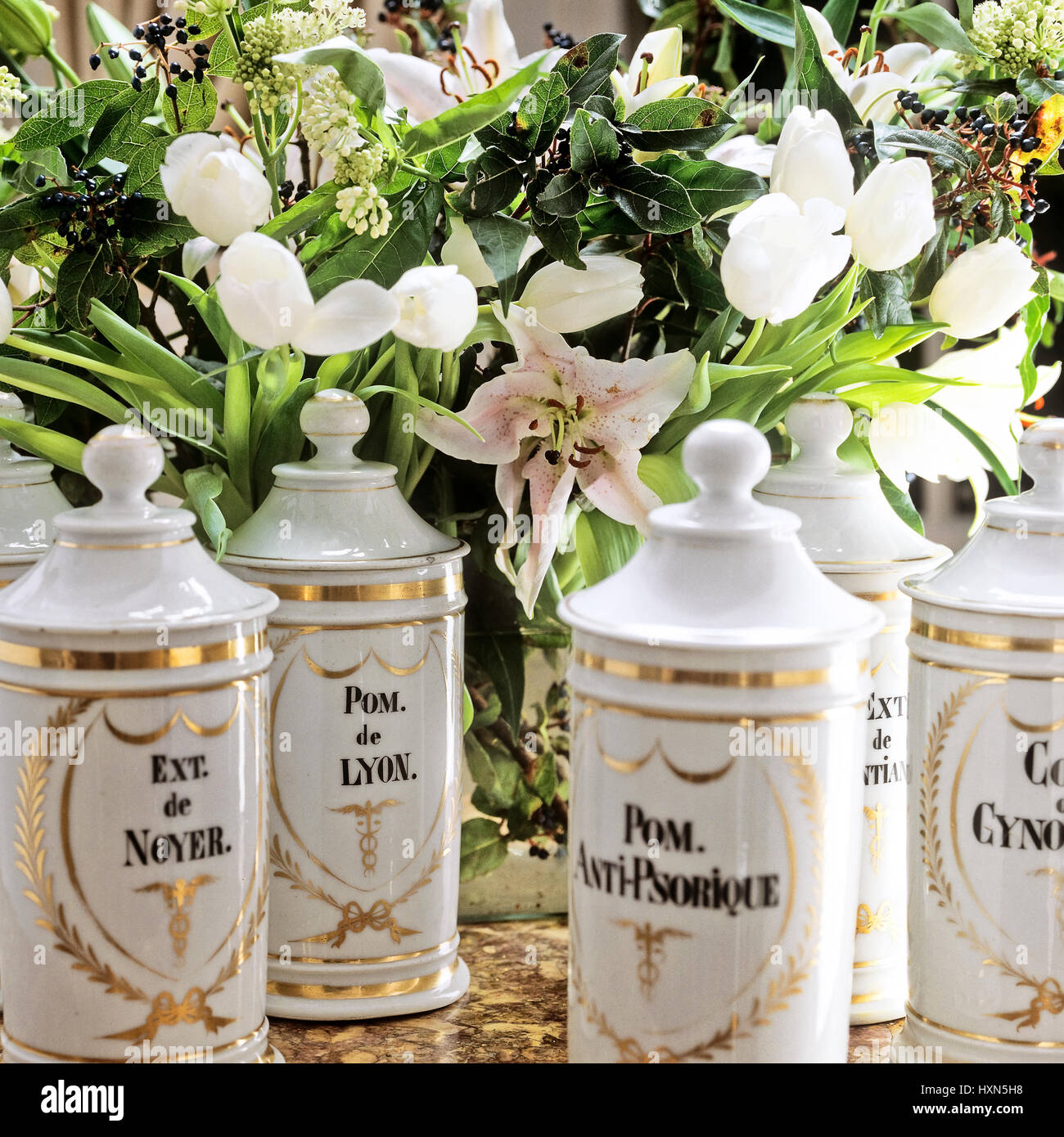 White jars and flowers Stock Photo Alamy