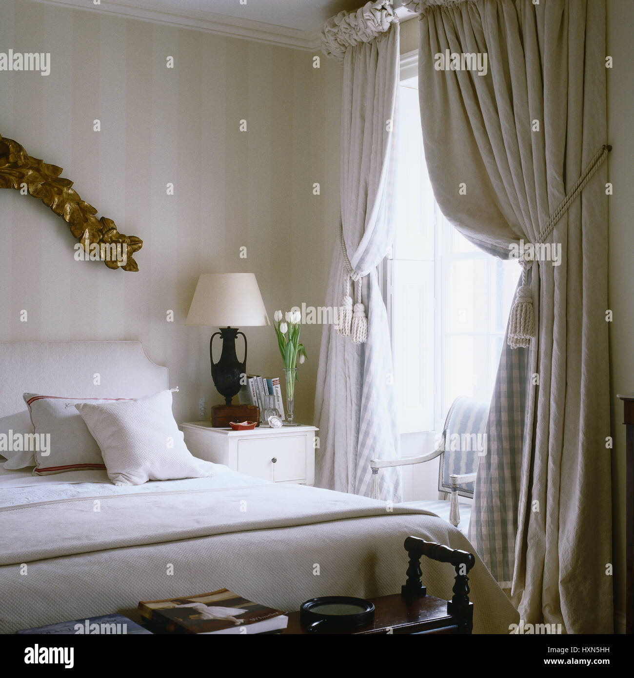 Bedroom with striped wallpaper Stock Photo Alamy