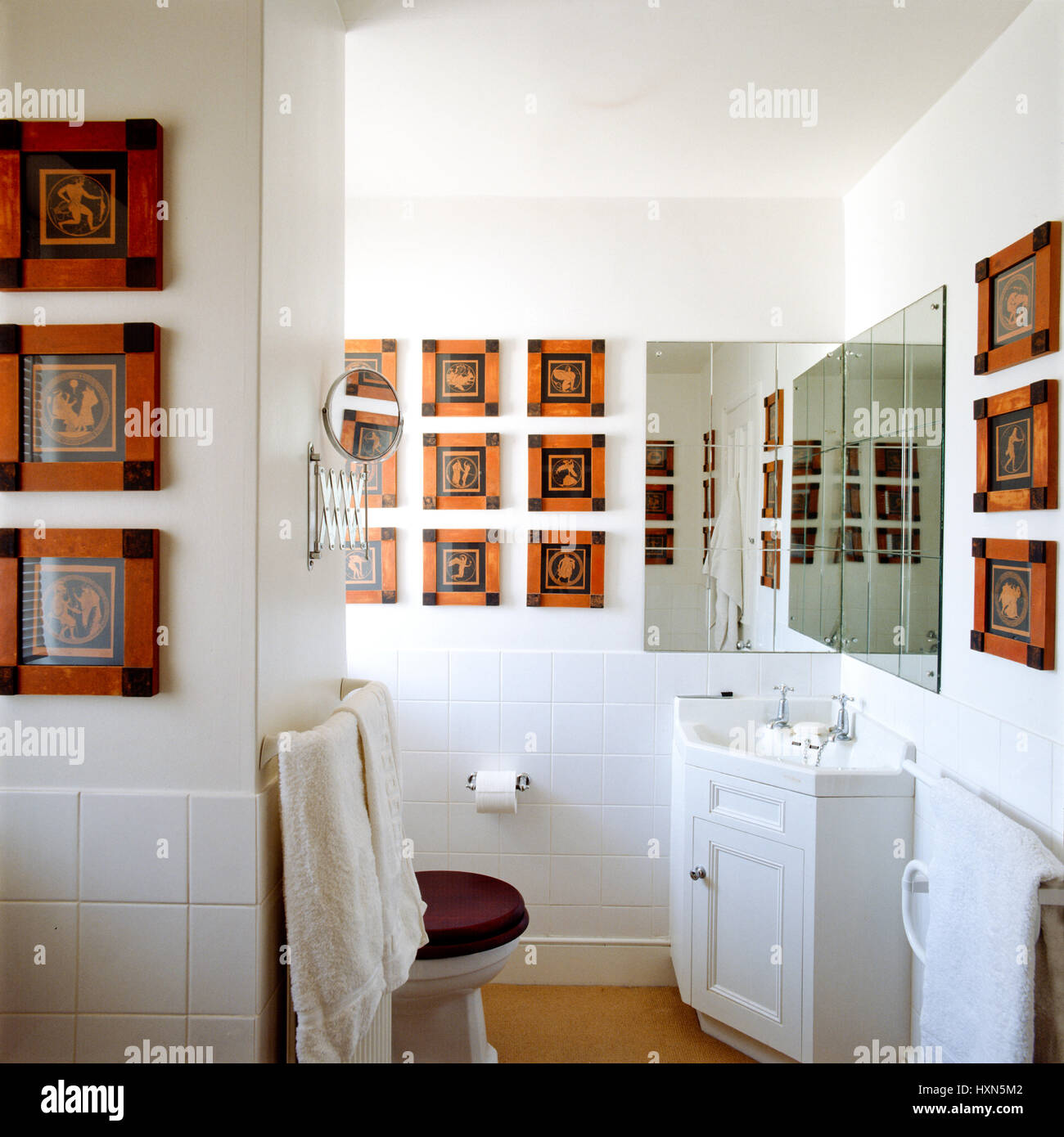 Bathroom with Greco-Roman pictures. Stock Photo