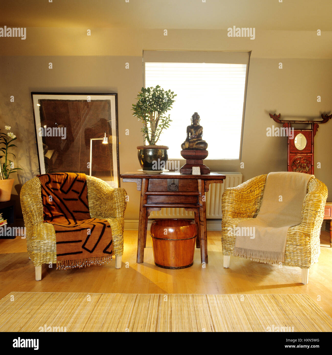 Table between two wicker armchairs Stock Photo Alamy
