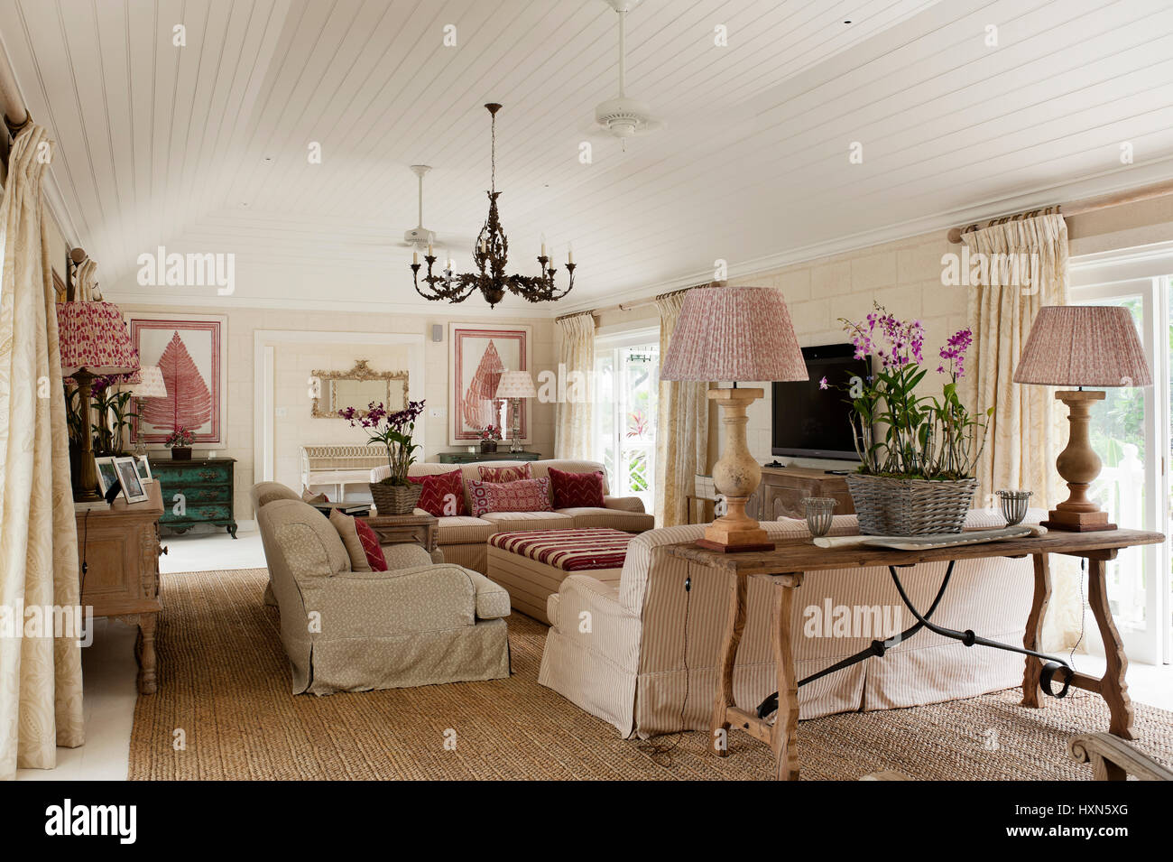 Red and white living room with lamps Stock Photo