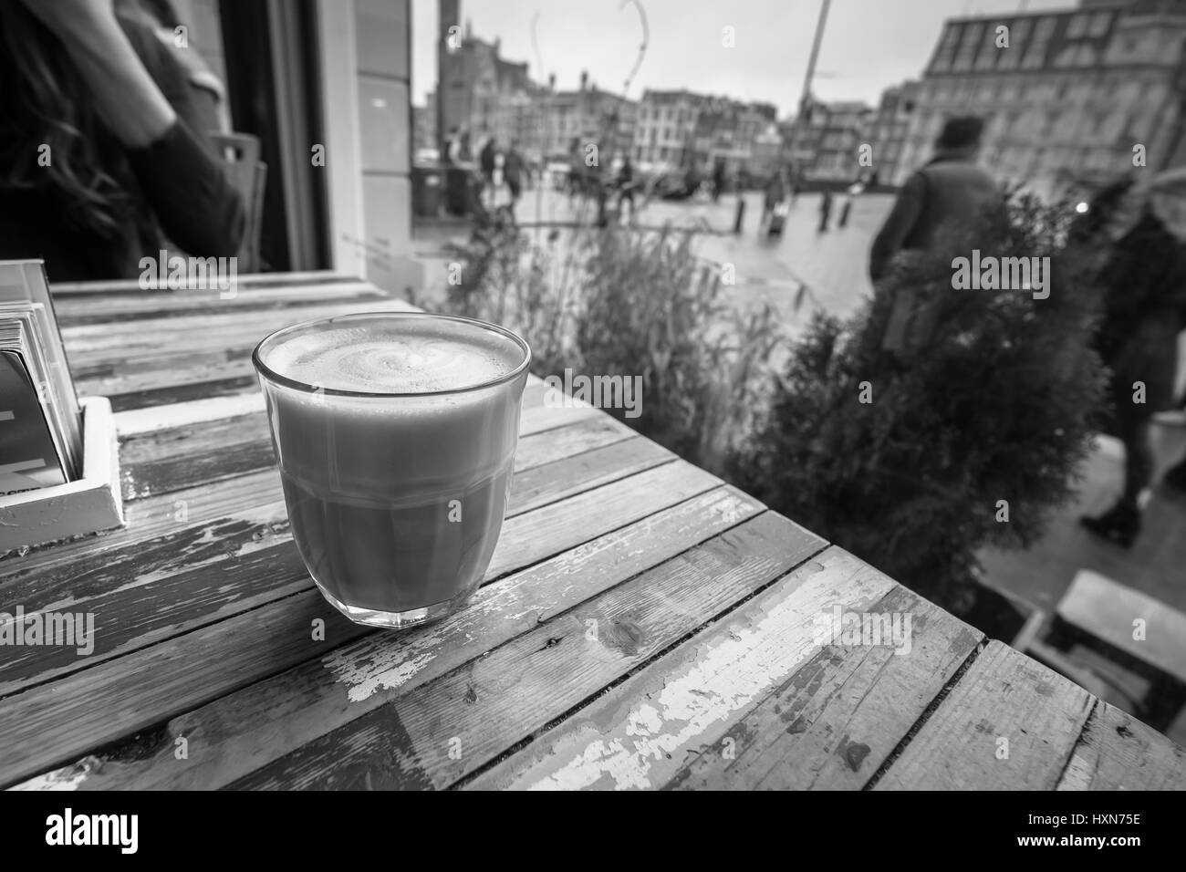 Coffee on a table in a coffe shop window. Stock Photo