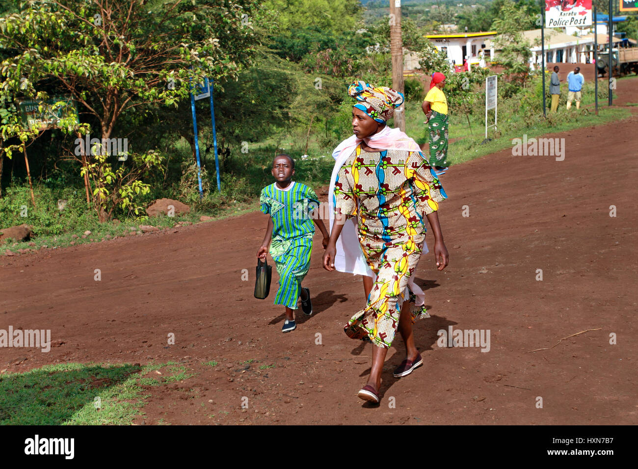 Makuyuni, Arusha, Tanzania - February 13, 2008: Blacks african people, unidentified woman and unidentified  child approximate age of 10 years old, are Stock Photo