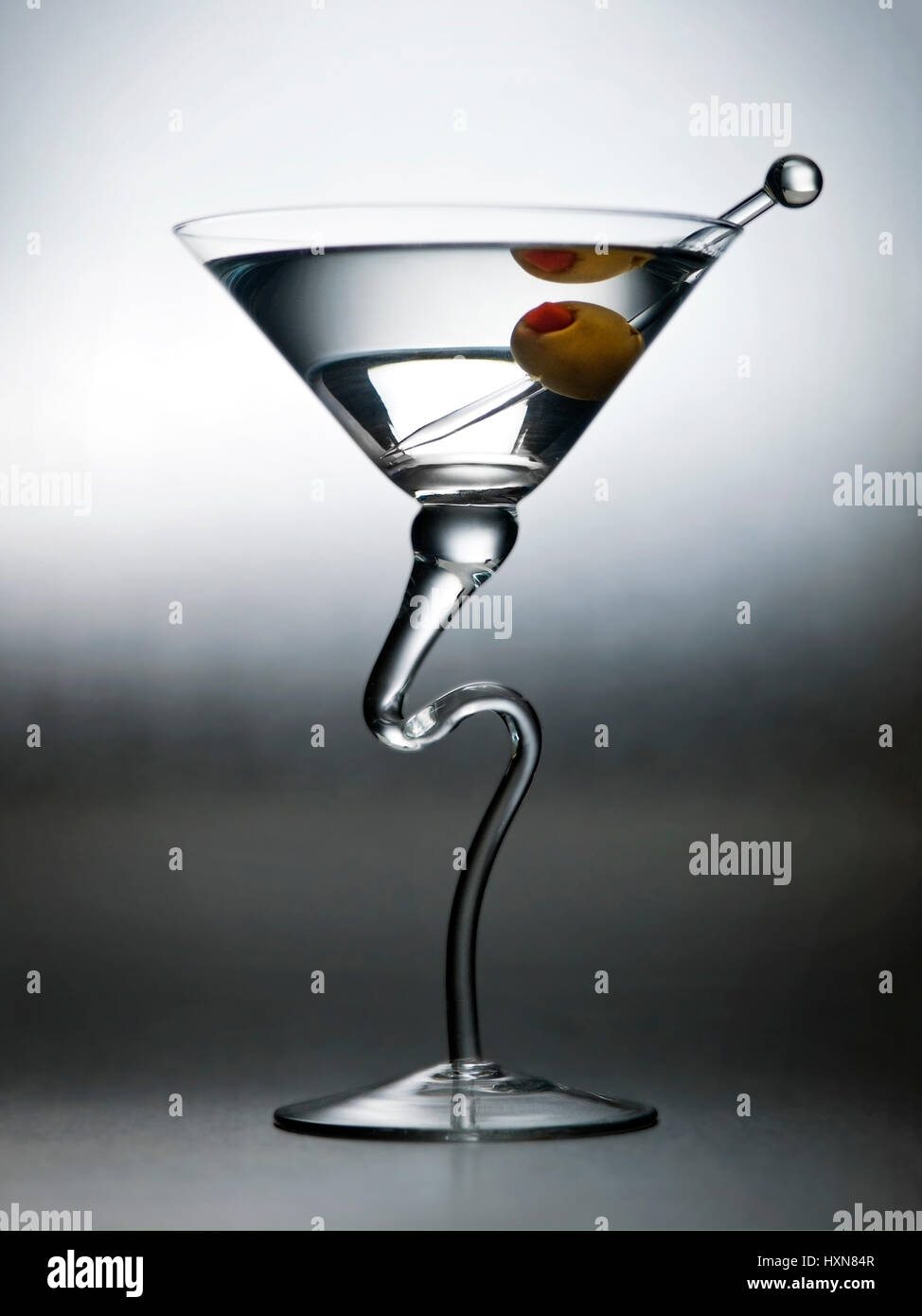 https://c8.alamy.com/comp/HXN84R/dry-martini-beverage-with-olive-and-fancy-glass-HXN84R.jpg